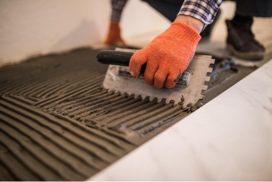 Workers are applying cement with calcium formate added